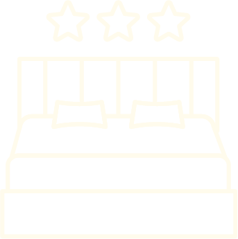 Dessin d'un lit avec deux oreillers et trois étoiles au-dessus, suggérant un hôtel ou un logement plutôt luxueux.
